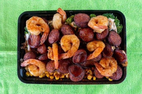 Large loaded potato with shrimp and sausage