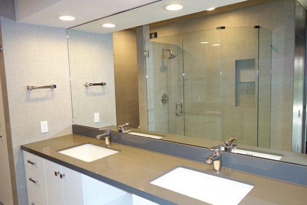 Fabric/Textile style large-format floor to ceiling wall-tile throughout bathroom, including custom shower.