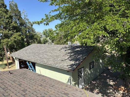 Brand new garage roof we did after replacing all rotted plywood underneath before replacing the house roof