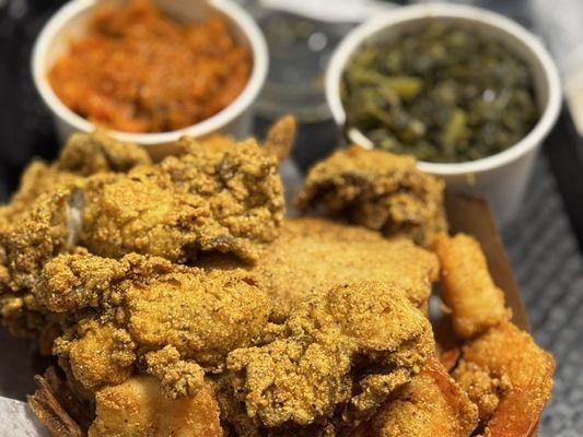 Fried tilapia oysters, and jumbo shrimp with greens and yams and cornbread and hush puppies