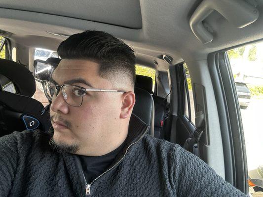 Skin mid fade, lineup in the front, trim on top for slick back/pomp