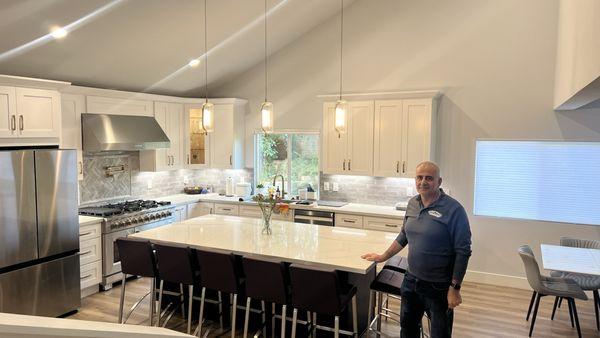 Moe (the project manager) standing in our open concept kitchen once it was complete.