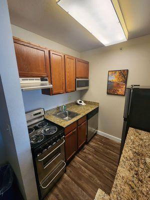 Full kitchen with granite countertops.