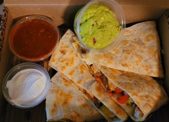 BBQ chicken quesadilla add mushrooms and cheddar with sour cream, salsa, and guacamole.