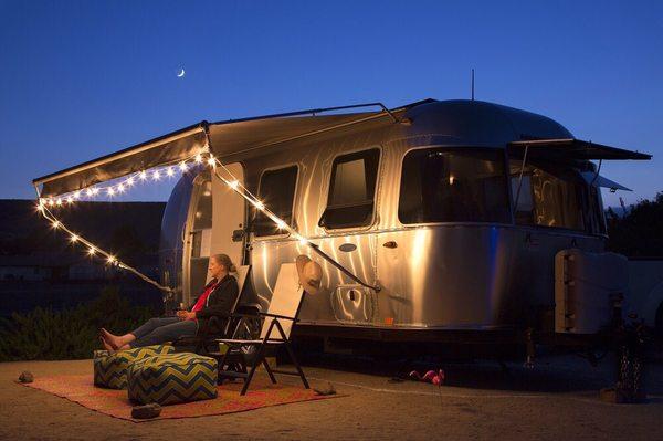 Don't forget to bring some string lights and an outdoor rug!