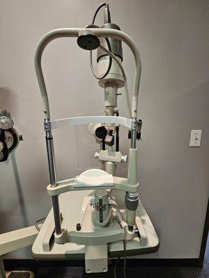 "Place your chin here and press your forehead forward..."