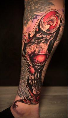 Black and gray and color fusion skull tattoo