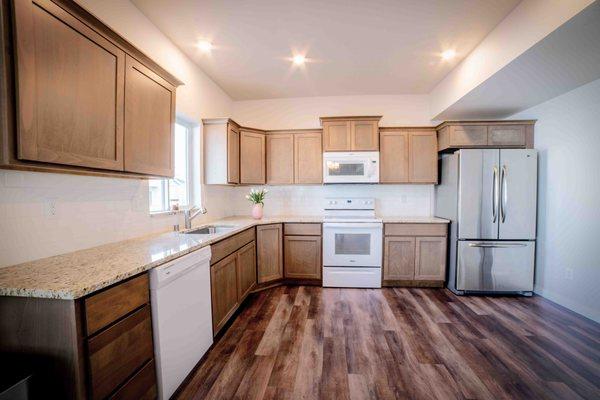 Kitchen view- Natural light flare from can spotlights.