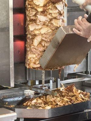 Rotisserie chicken cooked on open grill, perfectly seasoned and cooked for hours. Not overcooked or dry!