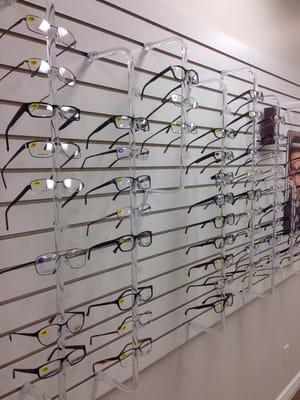 A large selection of frames on the wall