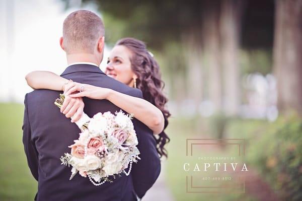 Vintage bridal bouquet with strands of pearls. Design by Cloud 9 Wedding Flowers, Photography by Captiva