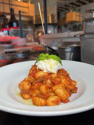 Gnocchi bolognese with ricotta and fresh basil. Olive oil