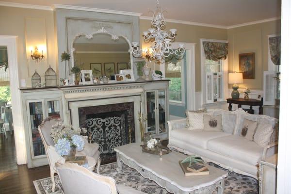 Living Room featuring custom painted furniture, fireplace mantel and chandelier all by Casual Chic Corner