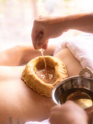 Kati basti is a treatment involving warm herbal oil on the lower back- this helps to alleviate back pain and menstral symptoms.