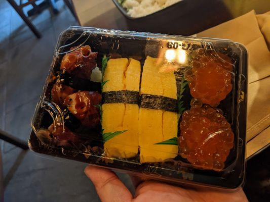 Eel, egg, salmon roe sushi to go