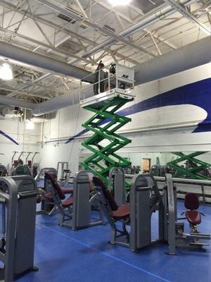 Performing an air duct cleaning job for a commercial client!