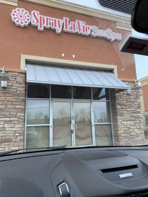 No sign indicating they're closed, but windows are taped up