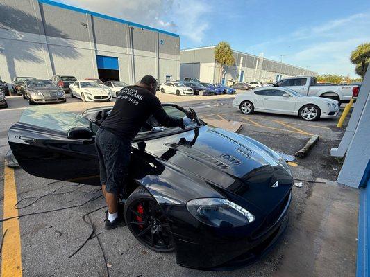 Luxury cars deserve expert care! Gator Autoglass getting this Aston Martin back to perfection.