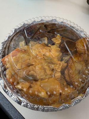 Small oxtail dinner with rice and beans, cabbage and plantains