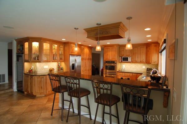 Kitchen remodel - Installation of granite counter-tops, prefabricated cabinets, and appliances.