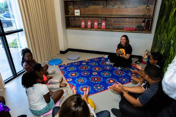 circle of kids at an event in a demo class to experience LaLa Lessons