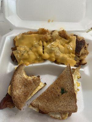 Bacon egg and cheese sandwich with cheesy hashbrowns