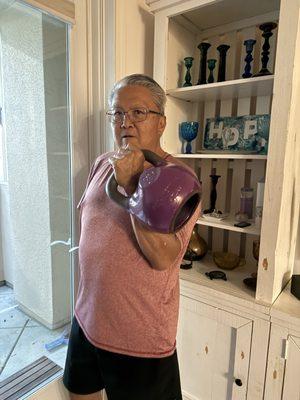 Holding a 20kg bell.