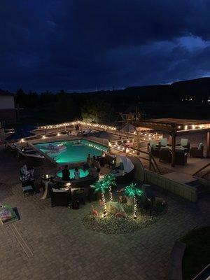 Pool and hot tub with the lights on