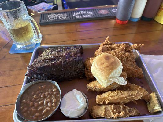 Sunday's special. It was very good. 1/2 slab of ribs, chicken breast, chicken wings, Jo Jo's and bake beans. ( you can pick your own sides)