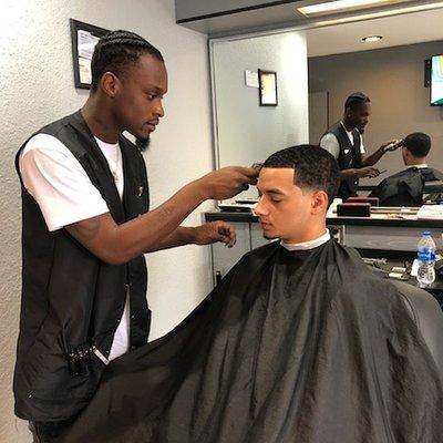 A number to Haircut with a fade on the side