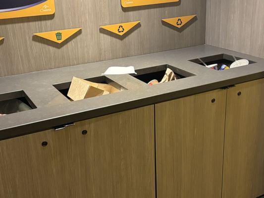 Most of the trash cans in the cinema were full and smelled