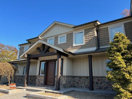 New front portico on front-to-back split level home.