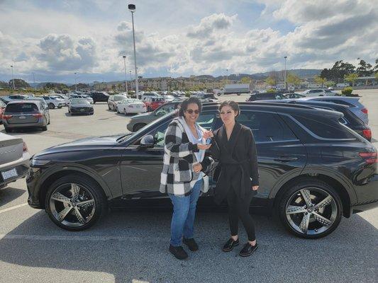 Samantha receiving her keys to her new GV70 for Cristal.