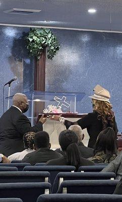 Dr. Lori and staff honoring a family's loved one with "the Closing of the Bier"