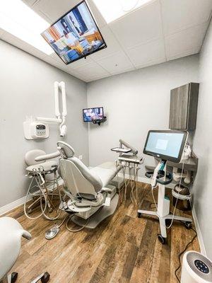 Comfortable treatment rooms with TVs.