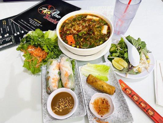Seafood TomYum soup w/herbs on the side, fried egg roll(I ate 2) , shrimp spring-rolls w/peanut butter sauce, & a pickled veggie salad