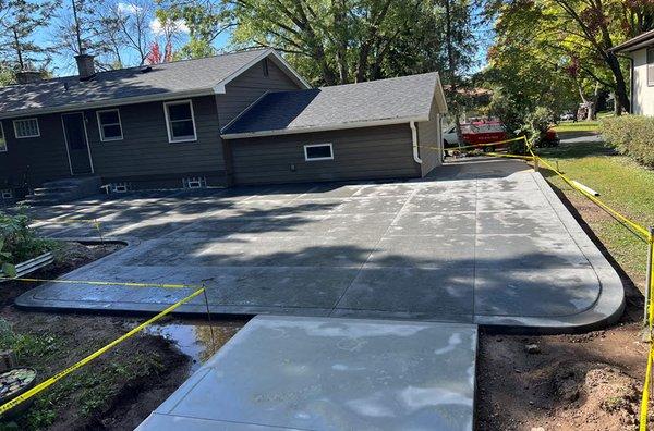 Stamped concrete patio & poured concrete driveway installed in White Bear Lake MN by Creative Concrete Inc