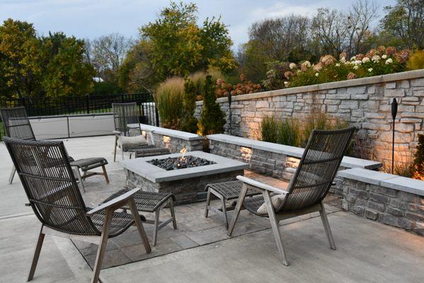 We did not install angled wall. Fire seating area right next to pool