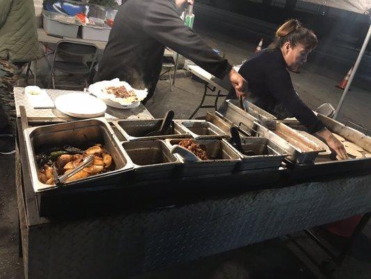 Meats, grilled onions and jalapeños, tortillas hecho a mano, and beans.