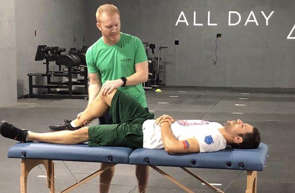 Dr. Nick Purcell, PT, DPT, SCS, CSCS teaching an injury prevention lab at All Day Crossfit in the Heights