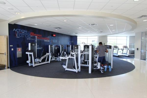 another area with strength machines and cardio equipment