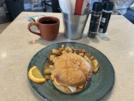 Pork roll (taylor) breakfast sandwich with home fries.