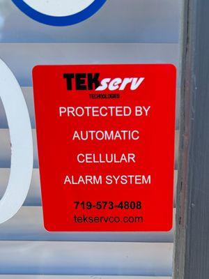 New TEKserv Alarm System door sticker