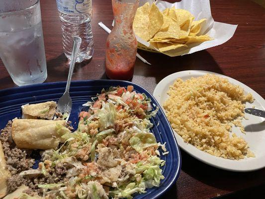 Taquitos, side of rice, chips and salsa, water