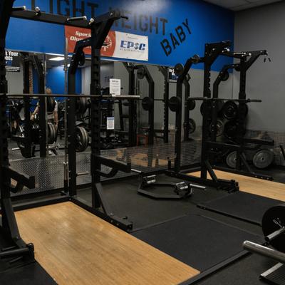 Dedicated powerlifting racks and barbell area.