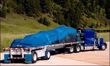 FLAT BED WITH 3' DROP TARP ON TRAILER.