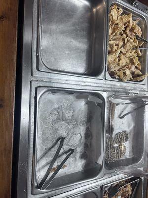 Empty pans over an hour before closing . Nothing being made