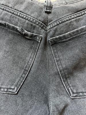 both of the back pockets are different lengths from the middle