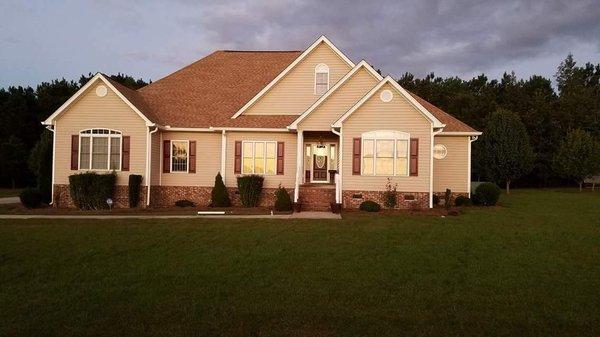 White 6" seamless gutter with 3x4 downspouts.