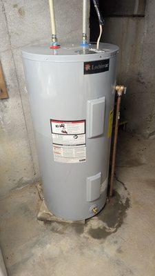 A handsome new hot water heater, in light gray. It's a shame to confine it to the basement, it's so good-looking.